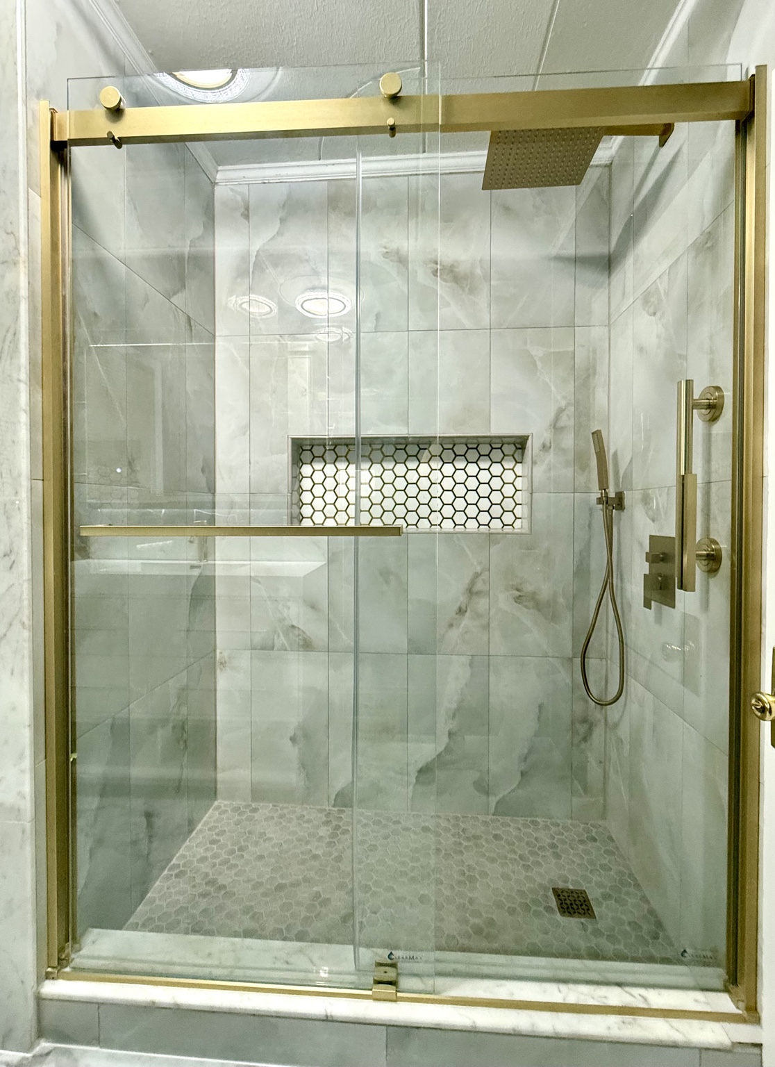 Gold-framed glass shower